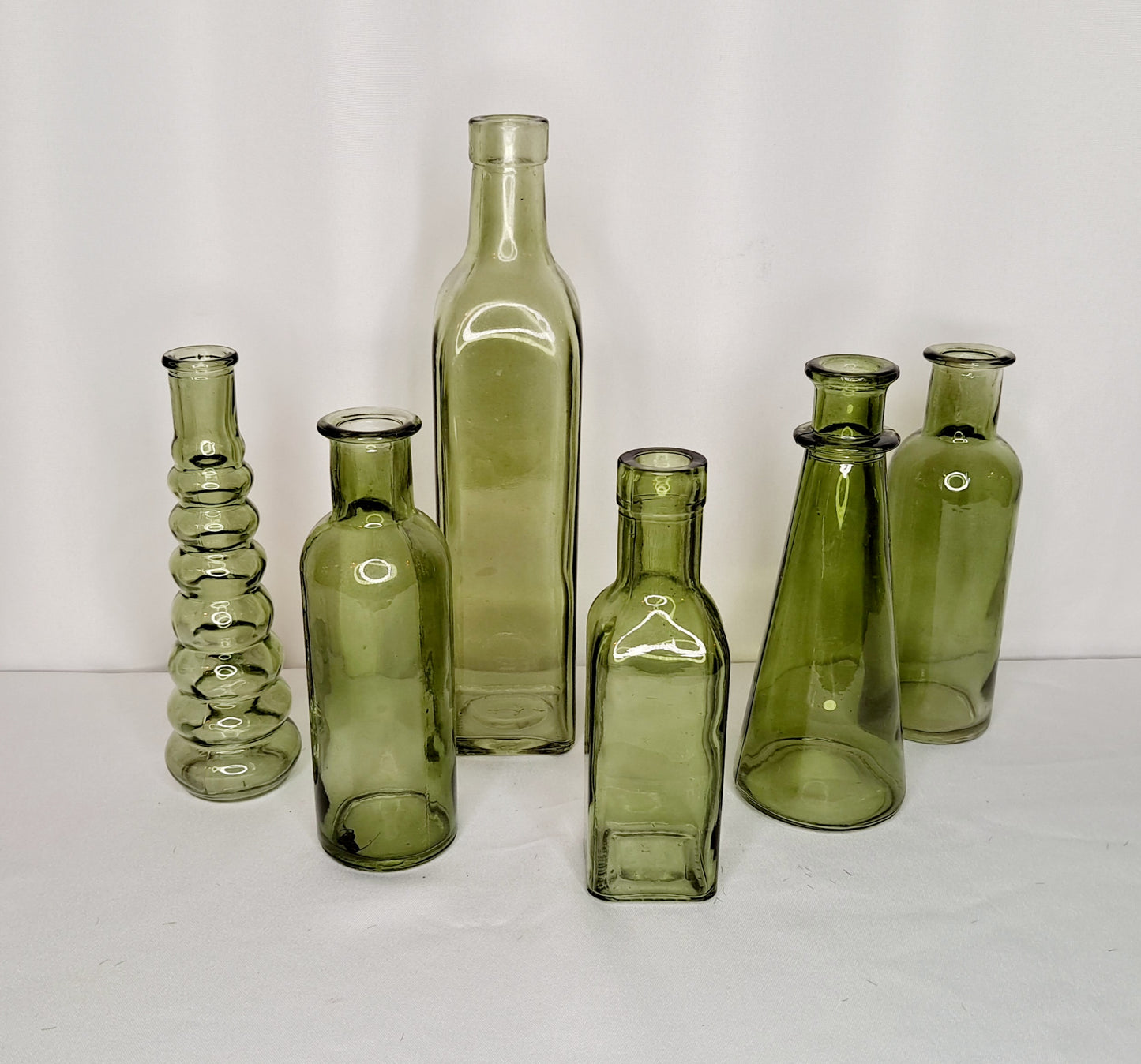 Assorted green glass bottles